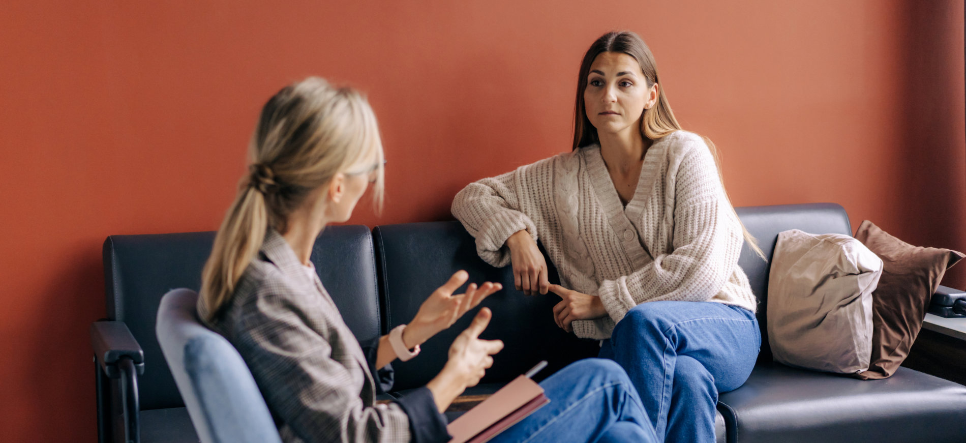 a female psychologist with a woman talking