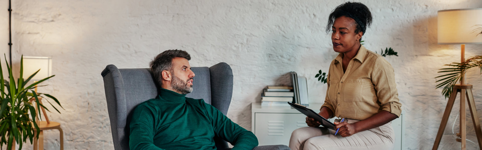 a man talking to a female psychologist