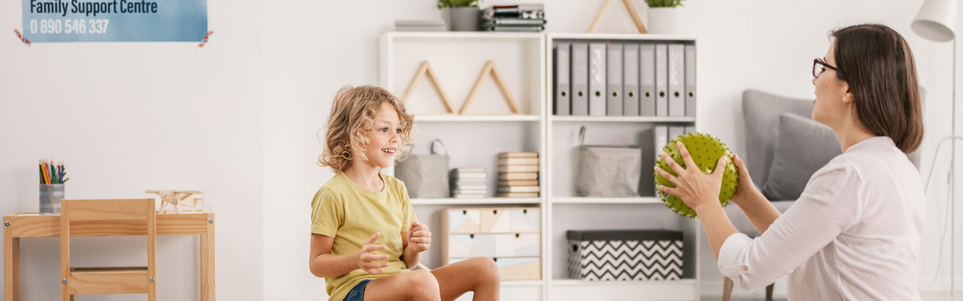 psychologist doing therapy with a kid