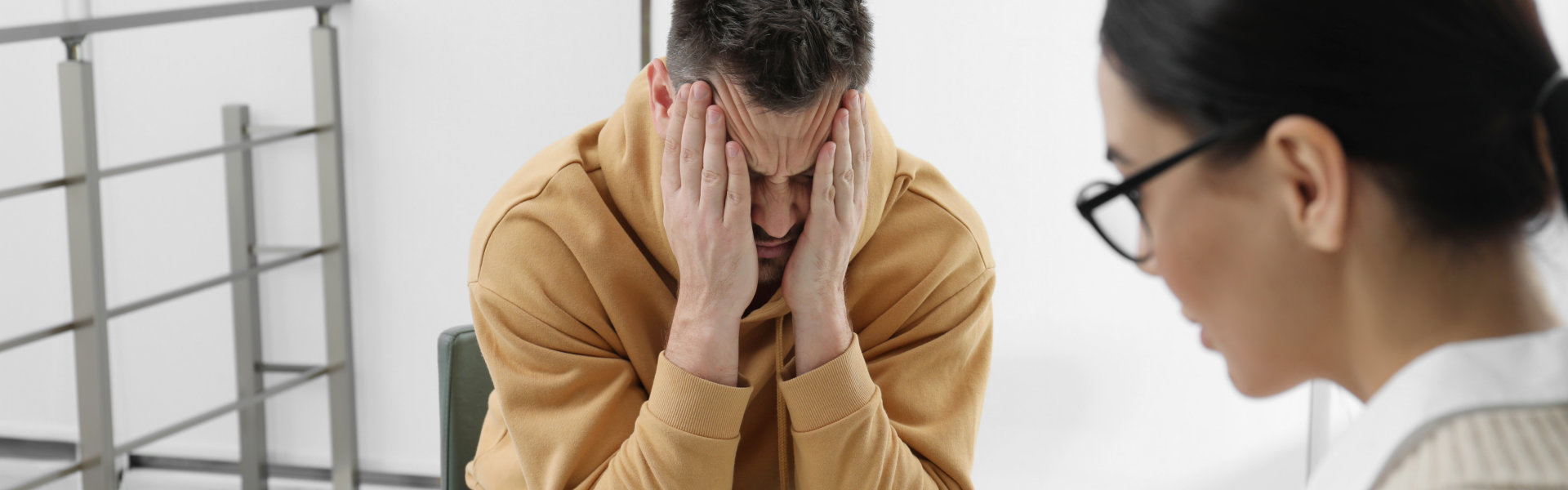 grieving man talking to his doctor