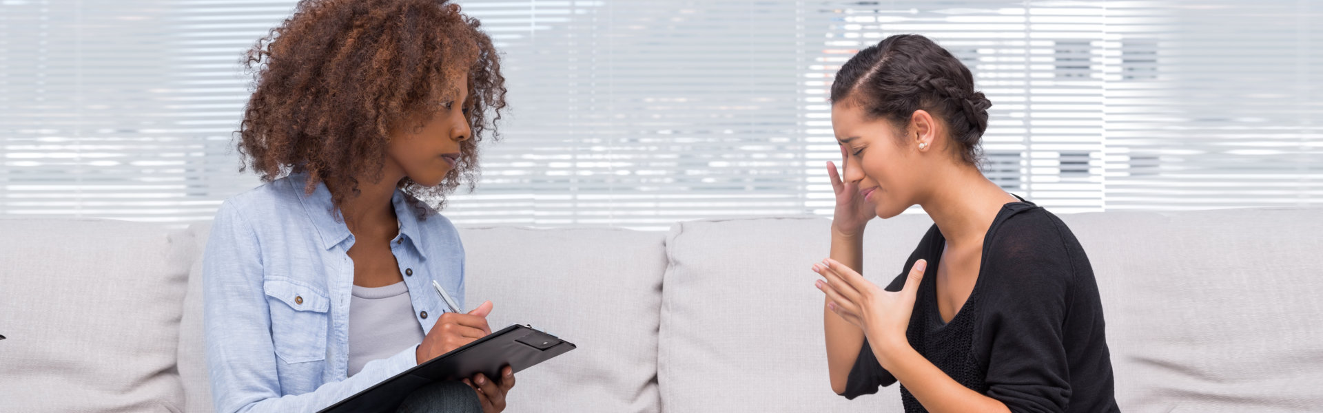 female psychologist listening to a woman